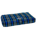 Blue and gray plaid monogrammed pet bed in living room in front of fireplace