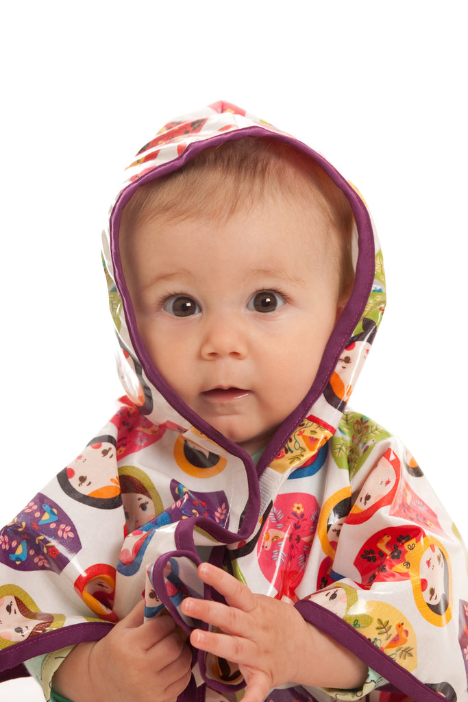 Baby poncho in a Russian matryoshka dolls pattern
