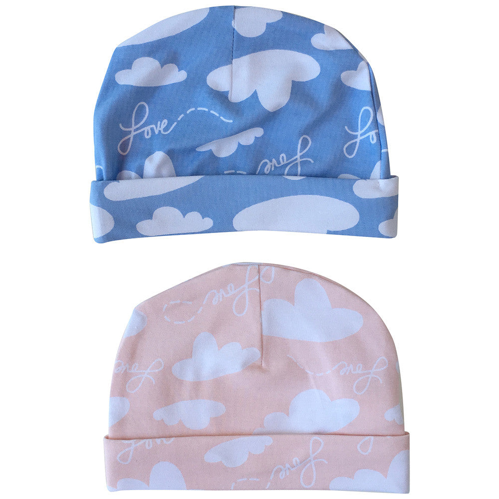 Baby hat in blue and pink with white clouds and love words